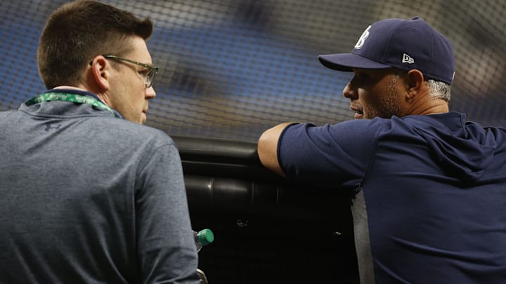 Oct 6, 2021; Tampa, Florida, USA; Tampa Bay Rays president Erik Neander and manager Kevin Cash (16) during the ALDS workout day against the Boston Red Sox at Tropicana Field. Mandatory Credit: Kim Klement-Imagn Images
