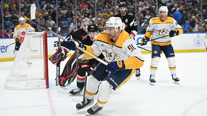 Jan 31, 2025; Buffalo, New York, USA; Nashville Predators center Steven Stamkos (91) chases the puck in front of Buffalo Sabres left wing Beck Malenstyn (29) in the first period at the KeyBank Center. Mandatory Credit: Mark Konezny-Imagn Images