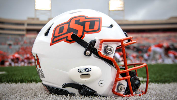 Aug 31, 2024; Stillwater, Oklahoma, USA; Oklahoma State Cowboys helmet sits on the field prior to the game against the South Dakota State Jackrabbits at Boone Pickens Stadium. Mandatory Credit: William Purnell-Imagn Images