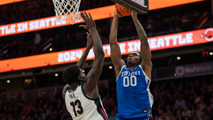 Dec 7, 2024; Seattle, Washington, USA;  Kentucky Wildcats guard Otega Oweh (00) shoots the ball against Gonzaga Bulldogs forward Graham Ike (13) during the second half at Climate Pledge Arena. Mandatory Credit: Stephen Brashear-Imagn Images