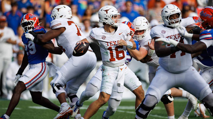 Texas Longhorns quarterback Arch Manning (16) throws the ball in the pocket against the Florida Gators during the first half. Texas Longhorns quarterback Arch Manning (16) throws the ball in the pocket against the Florida Gators during the first half.