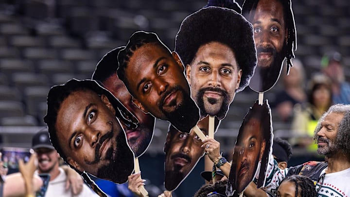 Dec 21, 2025; New Orleans, Louisiana, USA;  New Orleans Saints defensive end Cameron Jordan (94) poses for pictures with his family during warm ups before the game against the New York Jets at Caesars Superdome. Mandatory Credit: Stephen Lew-Imagn Images