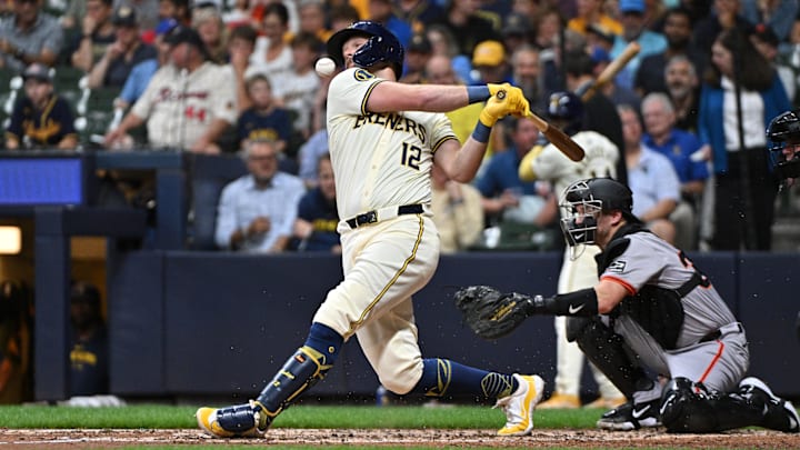 Aug 28, 2024; Milwaukee, Wisconsin, USA; Milwaukee Brewers first base Rhys Hoskins (12) fouls a ball off against the San Francisco Giants in the fifth inning at American Family Field.
