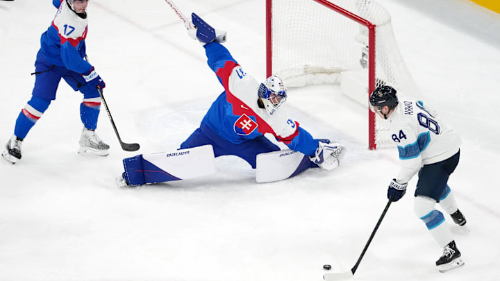Feb 21, 2026; Milan, Italy; Kaapo Kakko of Finland controls the puck against Samuel Hlavaj of Slovakia in the men's ice hockey bronze medal game during the Milano Cortina 2026 Olympic Winter Games at Milano Santagiulia Ice Hockey Arena. Mandatory Credit: James Lang-Imagn Images Feb 21, 2026; Milan, Italy; Kaapo Kakko of Finland controls the puck against Samuel Hlavaj of Slovakia in the men's ice hockey bronze medal game during the Milano Cortina 2026 Olympic Winter Games at Milano Santagiulia Ice Hockey Arena. Mandatory Credit: James Lang-Imagn Images
