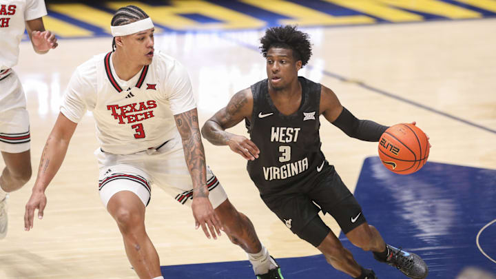Feb 8, 2026; Morgantown, West Virginia, USA; West Virginia Mountaineers guard Honor Huff (3) dribbles against Texas Tech Red Raiders forward Lejuan Watts (3) during the first half at Hope Coliseum. Mandatory Credit: Ben Queen-Imagn Images