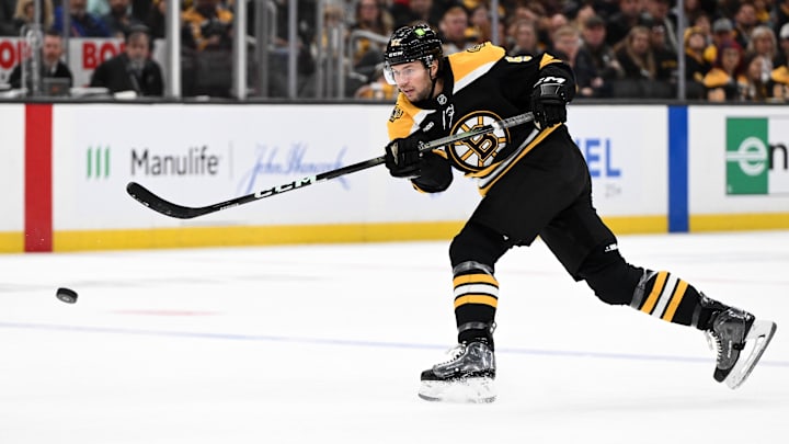 Nov 3, 2024; Boston, Massachusetts, USA; Boston Bruins defenseman Andrew Peeke (52) takes a shot against the Seattle Kraken during the first period at the TD Garden. Mandatory Credit: Brian Fluharty-Imagn Images