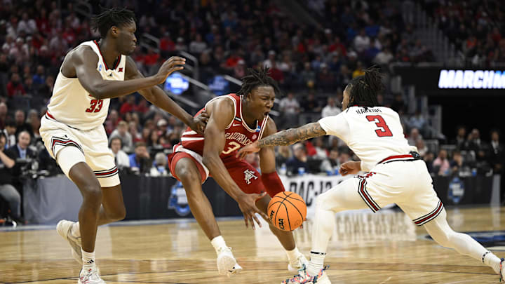 Mar 27, 2025; San Francisco, CA, USA; Arkansas Razorbacks forward Adou Thiero (3), Texas Tech Red Raiders forward Federiko Federiko (33) and guard Elijah Hawkins (3) battle for control of the ball during the first half during a West Regional semifinal of the 2025 NCAA tournament at Chase Center. Mandatory Credit: Eakin Howard-Imagn Images