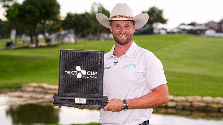 Wyndham Clark holds the CJ CUP trophy.