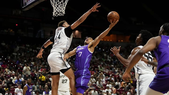 Jul 14, 2025; Las Vegas, NV, USA;  Utah Jazz forward John Tonje (17) drives towards the basket against San Antonio Spurs forward Carter Bryant (11)