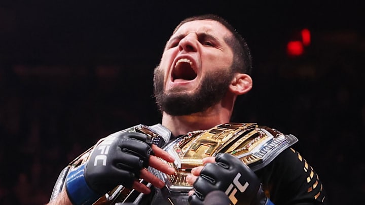 Nov 15, 2025; New York, NY, UNITED STATES; Islam Makhachev (blue gloves) celebrates after defeating Jack Della Maddalena (not pictured) by unanimous decision in the welterweight championship bout during UFC 322 at Madison Square Garden. Mandatory Credit: Ed Mulholland-Imagn Images