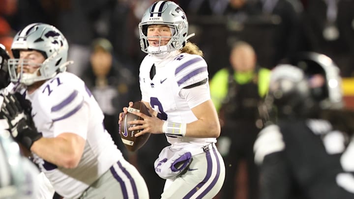 Nov 30, 2024; Ames, Iowa, USA; Kansas State Wildcats quarterback Avery Johnson (2) looks to pass against the Iowa State Cyclones in the first quarter at at Jack Trice Stadium. Mandatory Credit: Reese Strickland-Imagn Images