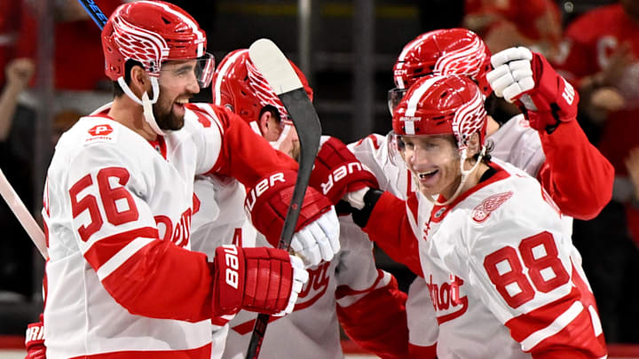 Mar 12, 2025; Detroit, Michigan, USA; Detroit Red Wings right wing Patrick Kane (88) celebrates with his teammates after scoring a goal against the Buffalo Sabres in the third period at Little Caesars Arena. Mandatory Credit: Lon Horwedel-Imagn Images