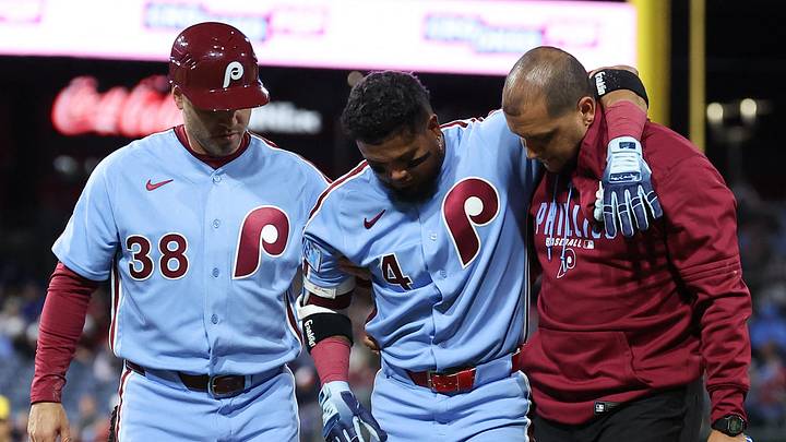 Sep 24, 2026; Philadelphia, Pennsylvania, USA; Philadelphia Phillies second baseman Luis Arraez (4) is helped off the field by trainer Christian Bermudez and first base coach Paco Figueroa (38) after being injured during the sixth inning against the Milwaukee Brewers at Citizens Bank Park. Mandatory Credit: Bill Streicher-Imagn Images Sep 24, 2026; Philadelphia, Pennsylvania, USA; Philadelphia Phillies second baseman Luis Arraez (4) is helped off the field by trainer Christian Bermudez and first base coach Paco Figueroa (38) after being injured during the sixth inning against the Milwaukee Brewers at Citizens Bank Park. Mandatory Credit: Bill Streicher-Imagn Images