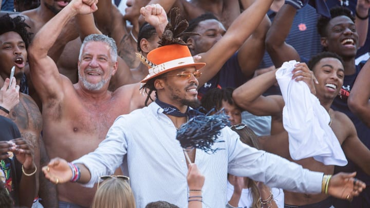 Auburn's mens basketball coach Bruce Pearl greets Auburn alum NFL quarterback Cam Newton at Jordan-Hare Stadium in Auburn, Ala., on Saturday, Oct. 9, 2021.