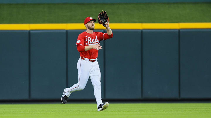Jul 10, 2024; Cincinnati, Ohio, USA; Cincinnati Reds outfielder Austin Slater (48) catches a fly out hit by Colorado Rockies outfielder Nolan Jones (not pictured) in the sixth inning at Great American Ball Park. Mandatory Credit: Katie Stratman-Imagn Images
