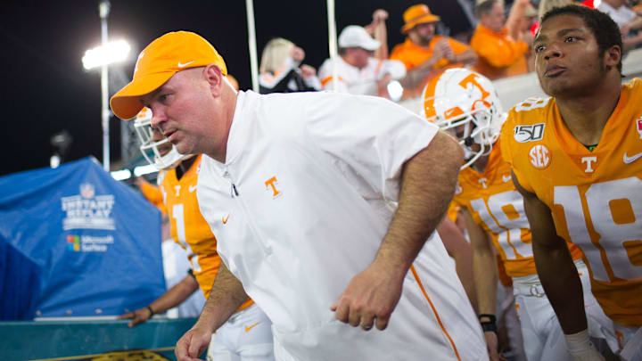 Tennessee football coach Jeremy Pruitt runs onto the field during the Gator Bowl game between Tennessee and Indiana at the TIAA Bank Field in Jacksonville, Fla., Jan. 2, 2020.