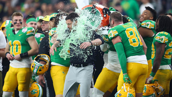 Jan 1, 2024; Glendale, AZ, USA; Oregon Ducks head coach Dan Lanning is doused with gatorade on the