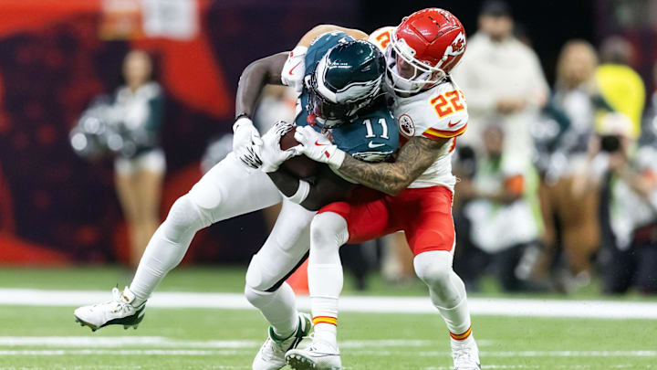 Feb 9, 2025; New Orleans, LA, USA; Philadelphia Eagles wide receiver A.J. Brown (11) is tackled by Kansas City Chiefs cornerback Trent McDuffie (22) during Super Bowl LIX at Ceasars Superdome. Mandatory Credit: Mark J. Rebilas-Imagn Images