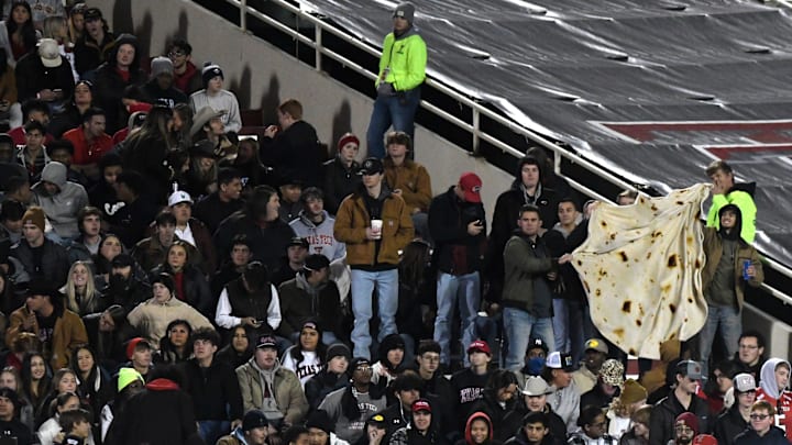 Texas Tech fans hold a tortilla blanket at the Big 12 football game against Kansas, Saturday, Nov. 12, 2022, at Jones AT&T Stadium.