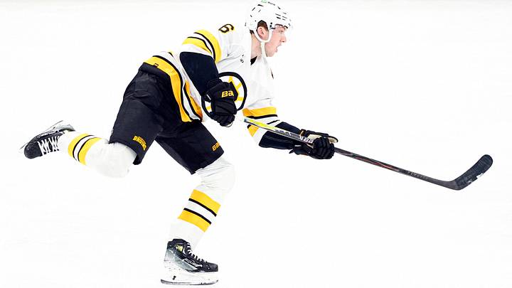 Jan 17, 2026; Chicago, Illinois, USA; Boston Bruins defenseman Mason Lohrei (6) shoots and scores against the Chicago Blackhawks during the third period at United Center. Mandatory Credit: Kamil Krzaczynski-Imagn Images