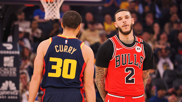 Golden State Warriors guard Stephen Curry (30) walks around Chicago Bulls guard Lonzo Ball (2) after missing a half court shot at the buzzer of the first quarter at Chase Center. Mandatory Credit: Kelley L Cox-Imagn Images