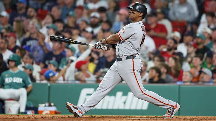 Giants DH Rafael Devers, hitting his return homer | Credit: Paul Rutherfords