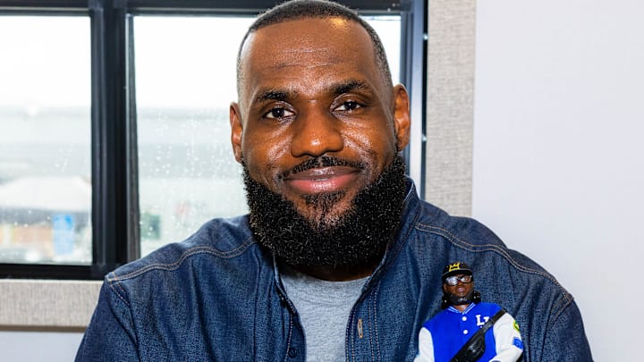 LeBron James poses with his new Barbie doll.