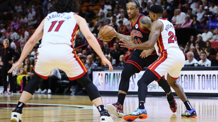 Apr 19, 2024; Miami, Florida, USA; Chicago Bulls forward DeMar DeRozan (11) dribbles the basketball as Miami Heat forward Haywood Highsmith (24) defends in the first quarter during a play-in game of the 2024 NBA playoffs at Kaseya Center. Mandatory Credit: Sam Navarro-USA TODAY Sports Apr 19, 2024; Miami, Florida, USA; Chicago Bulls forward DeMar DeRozan (11) dribbles the basketball as Miami Heat forward Haywood Highsmith (24) defends in the first quarter during a play-in game of the 2024 NBA playoffs at Kaseya Center. Mandatory Credit: Sam Navarro-USA TODAY Sports