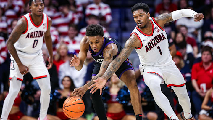 Dec 30, 2024; Tucson, Arizona, USA; Arizona Wildcats guard Caleb Love (1) knocks the ball out of the hands of TCU Horned Frogs guard Vesean Allette (3) during the second half of the game at McKale Center. Dec 30, 2024; Tucson, Arizona, USA; Arizona Wildcats guard Caleb Love (1) knocks the ball out of the hands of TCU Horned Frogs guard Vesean Allette (3) during the second half of the game at McKale Center.