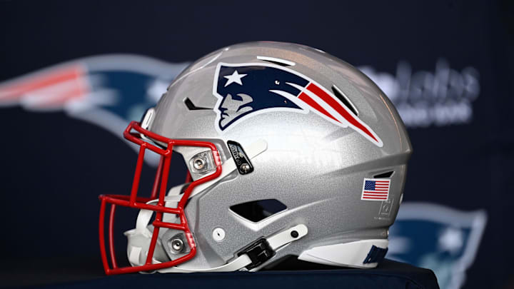 Jan 17, 2024; Foxborough, MA, USA; A New England Patriots helmet sits on a table prior to a press conference at Gillette Stadium. Mandatory Credit: Eric Canha-Imagn Images
