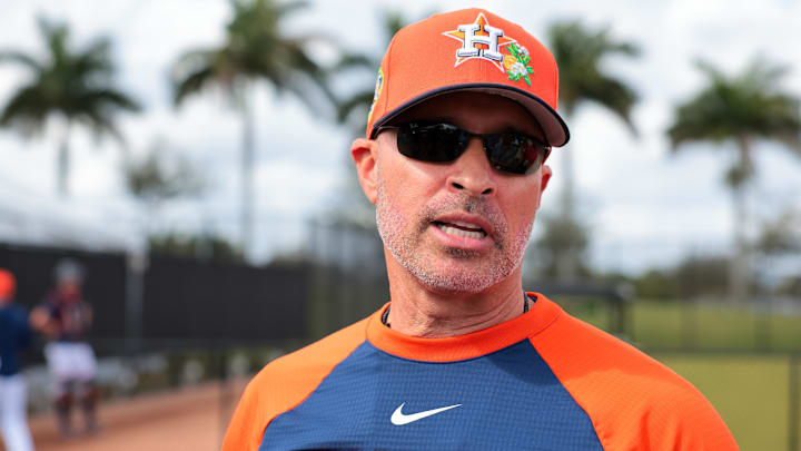 Houston Astros manager Joe Espada (19) speaks to reporters before a spring training workout. 