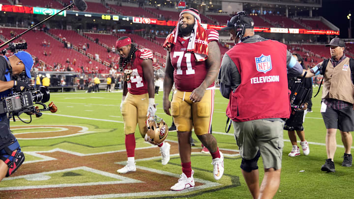 Sep 9, 2024; Santa Clara, California, USA; San Francisco 49ers offensive tackle Trent Williams (71) and running back Jordan Mason (left) walk off of the field after defeating the New York Jets at Levi's Stadium. Mandatory Credit: Darren Yamashita-Imagn Images