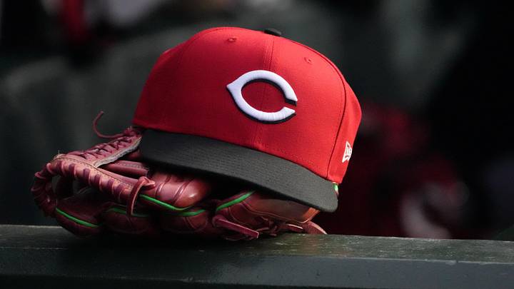 May 5, 2026; Chicago, Illinois, USA; A detail shot of Cincinnati Reds hat and glove in the dugout during the fourth inning against the Chicago Cubs at Wrigley Field. Mandatory Credit: David Banks-Imagn Images May 5, 2026; Chicago, Illinois, USA; A detail shot of Cincinnati Reds hat and glove in the dugout during the fourth inning against the Chicago Cubs at Wrigley Field. Mandatory Credit: David Banks-Imagn Images