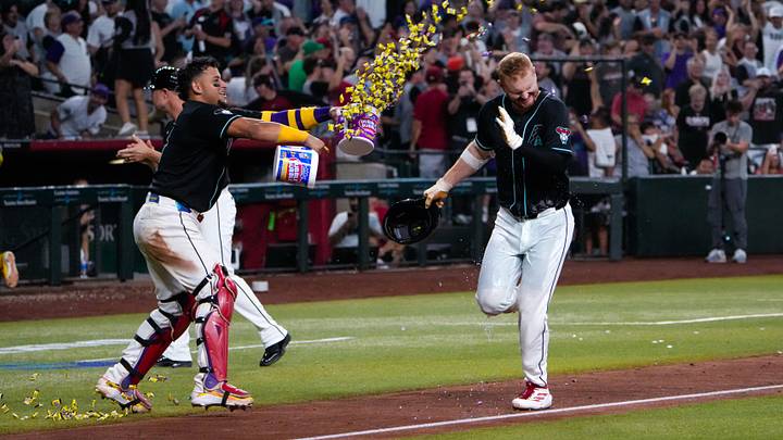 Sep 19, 2026; Phoenix, Arizona, USA; Arizona Diamondbacks catcher Gabriel Moreno (14) throws gum on first baseman Pavin Smith (26) after his walk off home run during the ninth inning at Chase Field during the game between the Arizona Diamondbacks and the New York Yankees. Mandatory Credit: Arianna Grainey-Imagn Images Sep 19, 2026; Phoenix, Arizona, USA; Arizona Diamondbacks catcher Gabriel Moreno (14) throws gum on first baseman Pavin Smith (26) after his walk off home run during the ninth inning at Chase Field during the game between the Arizona Diamondbacks and the New York Yankees. Mandatory Credit: Arianna Grainey-Imagn Images