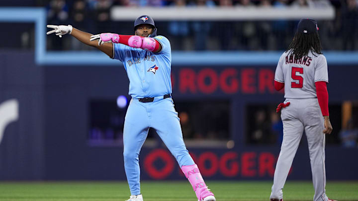 Toronto, Ontario, CAN; Toronto Blue Jays first baseman Vladimir Guerrero Jr. (27) celebrates hitting a double against the Washington Nationals during the second inning at Rogers Centre.