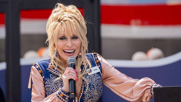 Dolly Parton smiles while speaking during the grand opening of Dolly's Tennessean Travel Stop on June 24 in Cornersville, Tennessee.