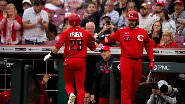 Cincinnati Reds center fielder TJ Friedl (29) high fives Cincinnati Reds designated hitter Eugenio Suárez (28) after scoring on a wild pitch in the eighth inning between the Cincinnati Reds and the Los Angeles Angels at Great American Ball in Cincinnati on Saturday, April 11, 2026. Cincinnati Reds center fielder TJ Friedl (29) high fives Cincinnati Reds designated hitter Eugenio Suárez (28) after scoring on a wild pitch in the eighth inning between the Cincinnati Reds and the Los Angeles Angels at Great American Ball in Cincinnati on Saturday, April 11, 2026.
