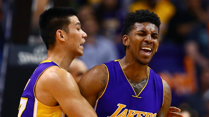 Jan 19, 2015; Phoenix, AZ, USA; Los Angeles Lakers wing Nick Young (0) reacts as he is restrained by teammate Jeremy Lin (17) against the Phoenix Suns at US Airways Center. The Suns defeated the Lakers 115-100. Mandatory Credit: Mark J. Rebilas-Imagn Images Jan 19, 2015; Phoenix, AZ, USA; Los Angeles Lakers wing Nick Young (0) reacts as he is restrained by teammate Jeremy Lin (17) against the Phoenix Suns at US Airways Center. The Suns defeated the Lakers 115-100. Mandatory Credit: Mark J. Rebilas-Imagn Images