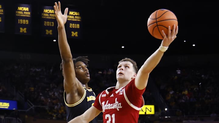 Jan 27, 2026; Ann Arbor, Michigan, USA;  Nebraska Cornhuskers guard Cale Jacobsen (31) shoots on Michigan Wolverines forward Morez Johnson Jr. (21) in the second half at Crisler Center. Mandatory Credit: Rick Osentoski-Imagn Images