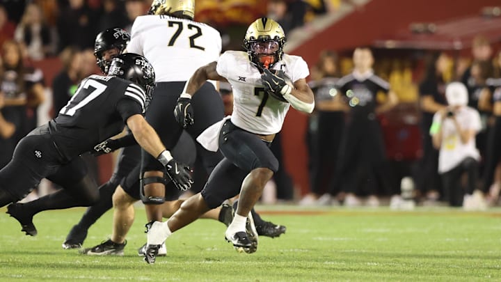 Oct 19, 2024; Ames, Iowa, USA;  UCF Knights running back RJ Harvey (7) runs away from Iowa State Cyclones defensive back Beau Freyler (17) at Jack Trice Stadium. Mandatory Credit: Reese Strickland-Imagn Images