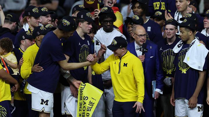 Apr 6, 2026; Indianapolis, IN, USA; Michigan Wolverines forward Yaxel Lendeborg (23) celebrates with Michigan Wolverines head coach Dusty May after defeating the UConn Huskies in the national championship of the Final Four of the men's 2026 NCAA Tournament at Lucas Oil Stadium. Mandatory Credit: Trevor Ruszkowski-Imagn Images
