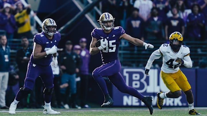 Tight end Keleki Latu finds room to run against Michigan. Tight end Keleki Latu finds room to run against Michigan.