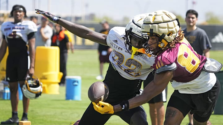 Arizona State cornerback Joseph Brown Jr. (22), left, defends wide receiver Zechariah sample (87) during football practice at Kajikawa practice fields in Tempe on Aug. 1, 2025.