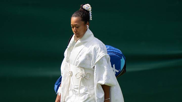 Jun 29, 2026; London, United Kingdom;  Naomi Osaka of Japan enters the court in her Japanese inspired ceremonial dress designed with designer Hana Yagi for her match against Elsa Jacquemot of France on day one at All England Lawn Tennis and Croquet Club. Mandatory Credit: Susan Mullane-Imagn Images