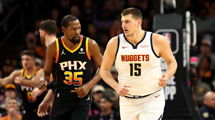 Denver Nuggets center Nikola Jokic (15) against Phoenix Suns forward Kevin Durant (35) at Footprint Center. Mandatory Credit: Mark J. Rebilas-USA TODAY Sports