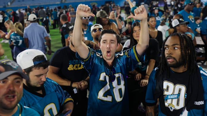 Will Rudowich, center, gives a thumbs down after the Jacksonville Jaguars traded their 17th pick for