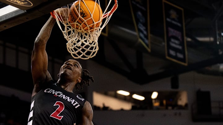 Cincinnati Bearcats guard Jizzle James (2) dunks in the first half of the NCAA basketball game against the Northern Kentucky Norse at Truist Arena in Highland Heights, Ky., on Tuesday, Nov. 19, 2024.