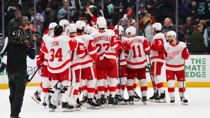 Feb 4, 2025; Seattle, Washington, USA; The Detroit Red Wings celebrate defeating the Seattle Kraken at Climate Pledge Arena. Mandatory Credit: Steven Bisig-Imagn Images