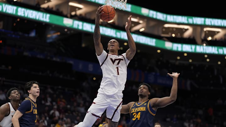 March 11, 2025. Virginia Tech forward Tobi Lawal (1) attempts a layup defended by California forward Lee Dort (34). March 11, 2025. Virginia Tech forward Tobi Lawal (1) attempts a layup defended by California forward Lee Dort (34).