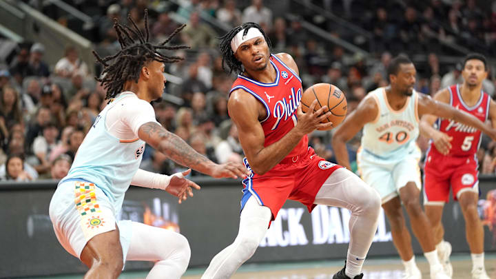 Mar 21, 2025; San Antonio, Texas, USA; Philadelphia 76ers guard Ricky Council IV (14) dribbles against San Antonio Spurs guard Stephon Castle (5) during the fourth quarter at Frost Bank Center. Mandatory Credit: Dustin Safranek-Imagn Images Mar 21, 2025; San Antonio, Texas, USA; Philadelphia 76ers guard Ricky Council IV (14) dribbles against San Antonio Spurs guard Stephon Castle (5) during the fourth quarter at Frost Bank Center. Mandatory Credit: Dustin Safranek-Imagn Images